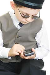 Image showing Kid busy with palm computer and stylus 