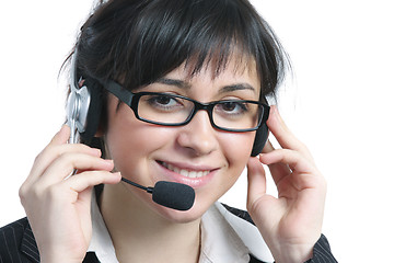 Image showing Smiling brunette businesswoman with headset