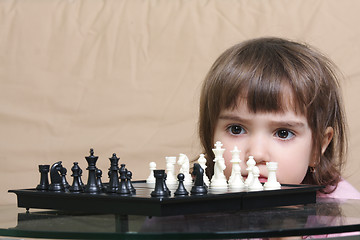 Image showing Girl considering chess position