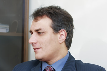 Image showing Concentrated businessman sideview