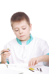 Image showing Boy and lab tools on desk