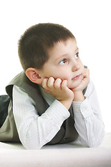 Image showing Little kid laying on pale ground