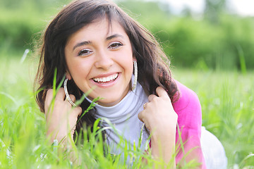 Image showing Positive brunette in grass