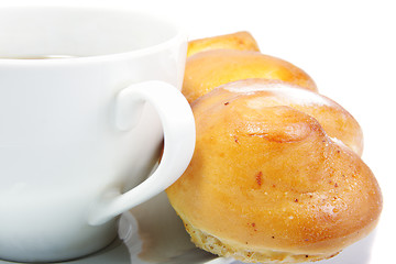 Image showing Cup and bun against white