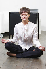 Image showing Businesswoman in yoga pose
