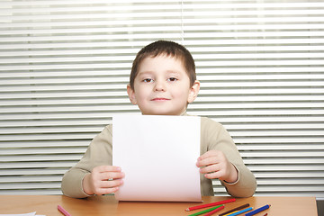 Image showing Boy with blank paper