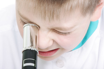 Image showing Kid with microscope closeup