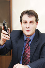 Image showing Businessman giving phone