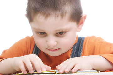 Image showing Boy sitting with open book