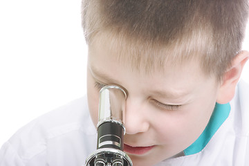 Image showing Kid looking into microscope closeup