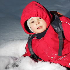 Image showing Boy laying in snow