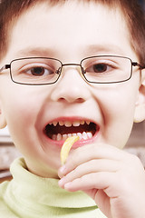 Image showing Boy going to eat fried potato