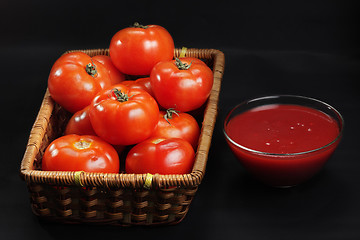 Image showing Basket with only intact tomatoes and ketchup