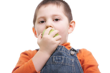 Image showing Boy biting apple