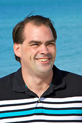 Image showing average dark haired man smiling