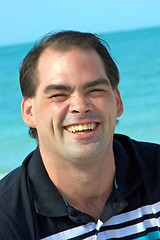 Image showing handsome man laughing at beach