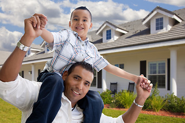 Image showing Hispanic Father and Son in Front of House