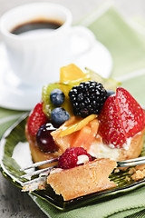 Image showing Assorted berry tart with coffee