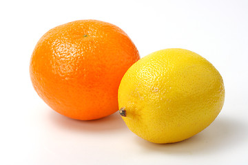 Image showing Red mandarin and yellow lemon