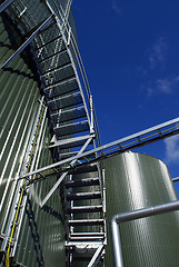 Image showing Industrial zone, Steel pipe-lines on blue sky