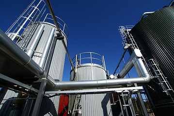 Image showing Industrial zone, Steel pipe-lines on blue sky