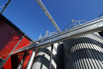 Image showing Industrial zone, Steel pipe-lines on blue sky