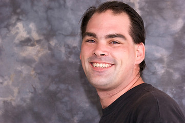 Image showing handsome brown eyed man smiling