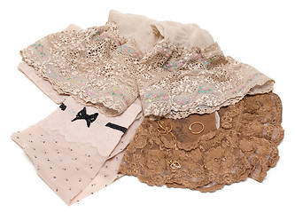 Image showing Lacy pantyhose and gold(en) embellishment