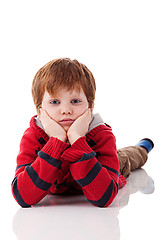 Image showing Cute boy, lying on the floor