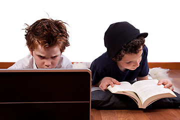 Image showing children playing computer and reading a book