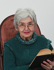 Image showing Old woman with a book