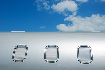 Image showing Closed windows on gray metallic corporate jet