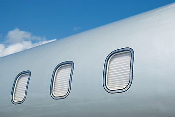 Image showing Closed windows on gray metallic corporate jet