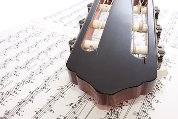 Image showing Closeup Guitar Headstock and Notes