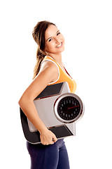 Image showing Athletic girl with a scale