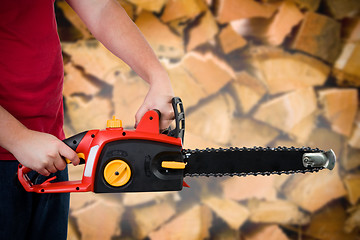 Image showing Man Holding Chainsaw 