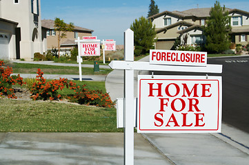 Image showing Row of Foreclosure Home For Sale Real Estate Signs
