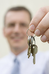 Image showing Real-estate agent handing over keys