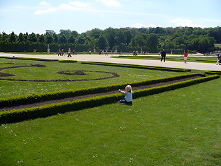 Image showing Austria. Vienna. Schonbrunn. Garden Great Parterre & little child - gardener