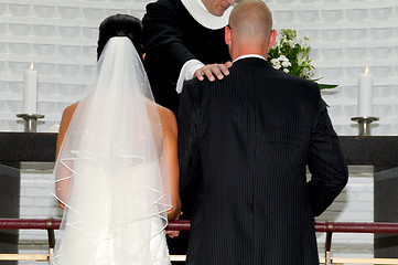 Image showing Bride and groom and prist