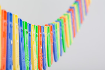 Image showing Many colorful clothe pegs in a row