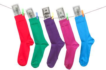 Image showing colorful socks with cash hang on rope