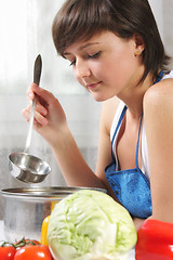 Image showing Woman cooking food