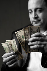 Image showing Man Counting Cash