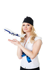 Image showing Flight attendant with model of aircraft