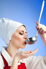 Image showing Chef tasting soup from ladle