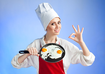 Image showing Chef with pan and frying egg