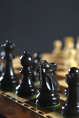 Image showing Black chess pieces on board