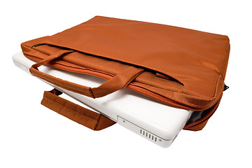 Image showing Orange bag and white laptop