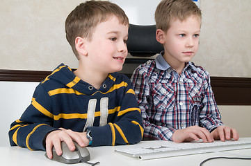 Image showing Boys on a computer